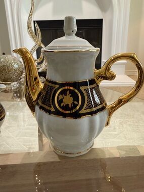 Elegant Gold-Trimmed Porcelain Teapot with Black Medallion
